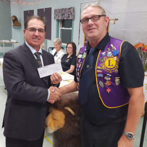 Joe Samson, board chair for St Anne Community and Nursing Care Centre, accepts a Lions Club donation of $1,500 from King Lion Barry LeBlanc.