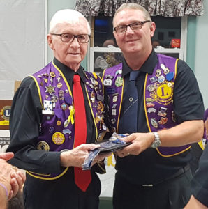 King Lion Barry LeBlanc presents Lion Don Cornell with a special Lions tie in appreciation of his long standing work with the Louisdale Lions Club.