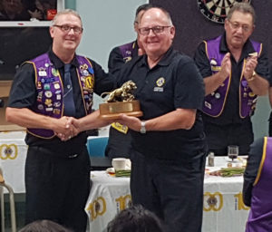 Lion Robert Goyetche accepts the Lion of the Year award from King Lion Barry LeBlanc