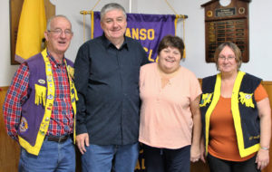 Sponsor Lion Barry Lumsden (left) joined new Lions Dave and Roberta Parker and King Lion Janet Delorey following their induction as new Lions.