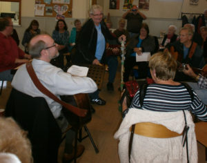 Photo by Cathy Cooke Port Hawkesbury’s Gail MacKay (standing) provided the rhythm section for the first-ever Celtic Colours “Causeway Song Session” on October 14, as she brought her “Ugly Stick” to St. David’s United Church in Port Hastings.  