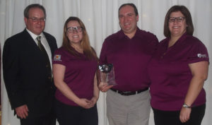 Strait Area Chamber of Commerce president David Hart (left) presented the chamber’s Export Achievement Award to Mulgrave’s DSM Nutritional Products, represented by Jacalyn White (second from left), John Grimes and Shari Grimes, during the chamber’s annual Fall Awards Dinner at the Port Hawkesbury Civic Centre. 
