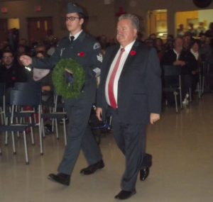 Guysborough-Eastern Shore-Tracadie MLA Lloyd Hines (right) prepares to lay a wreath on behalf of the provincial government, during Sunday afternoon’s Remembrance Ceremony at the Havre Boucher Community Centre. 
